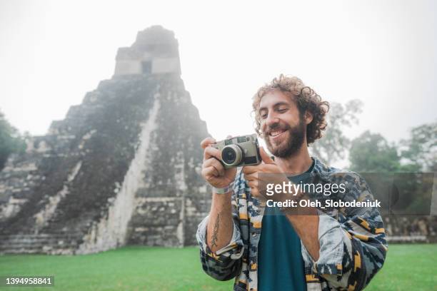 man photographing in  tikal national park - central america landscape stock pictures, royalty-free photos & images