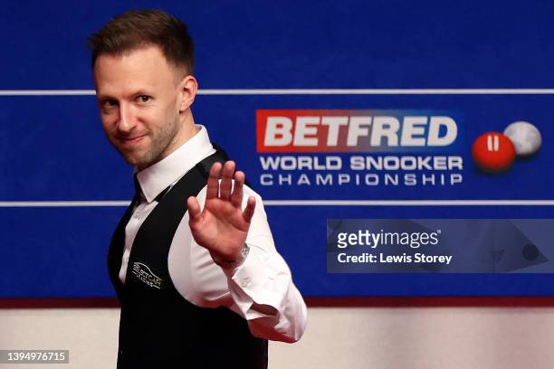 Judd Trump of England celebrates after winning the first session of the day by a score of 6-2 during the Betfred World Snooker Championship Final...
