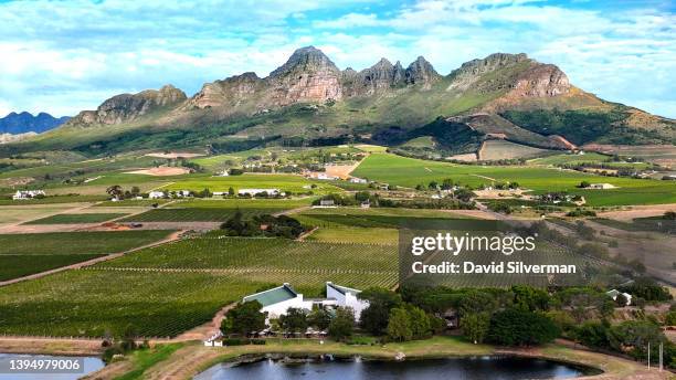 An evening aerial view of the Eikendal winery estate on the slopes of the Helderberg Mountain during harvest season on March 15, 2022 in the Western...