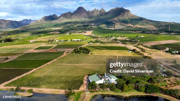 An evening aerial view of the Eikendal winery estate on the slopes of the Helderberg Mountain during harvest season on March 15, 2022 in the Western...