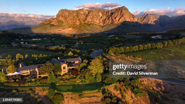 An evening aerial view the Tokara Wine Estate below the Drakenstein Mountains on March 14, 2022 in the Western Cape wine-producing town of...
