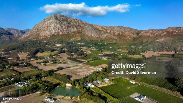 An aerial view of the winery estates and farms during harvest season on March 12, 2022 in the Western Cape wine-producing town of Franschhoek, South...