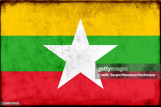 flag of myanmar with a grunge texture, burmese flag - myanmar war stock pictures, royalty-free photos & images