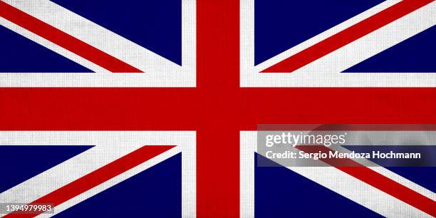 flag of the united kingdom, the union jack, with a grunge linen texture, british flag - bandera del reino unido fotografías e imágenes de stock