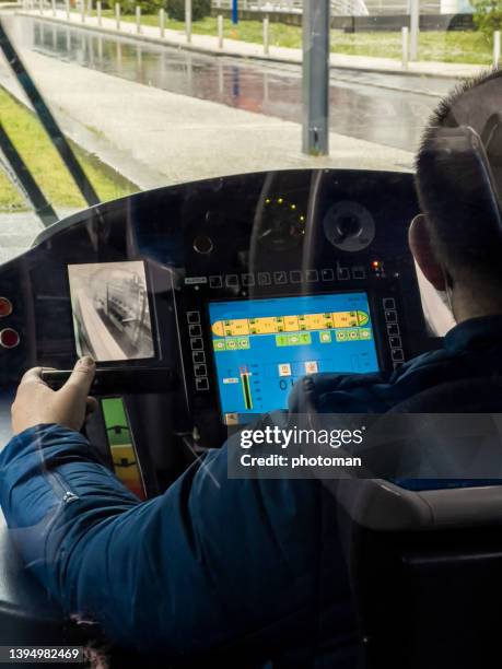 rear view on train operator in control room - train driver stock pictures, royalty-free photos & images