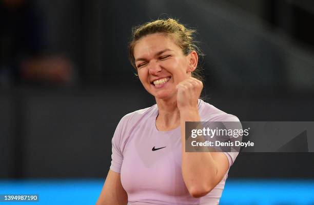 Simona Halep of Romania celebrates victory in her third round match against Coco Gauff of the United States during day five of the Mutua Madrid Open...
