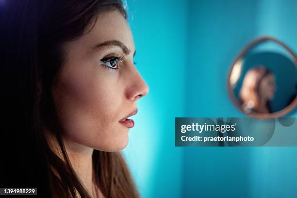 portrait of depressed young woman - schizophrenia stock pictures, royalty-free photos & images