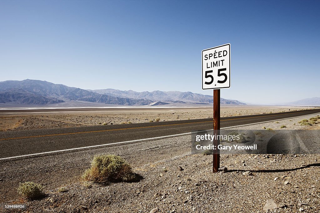 Roadside sign in desert landscape