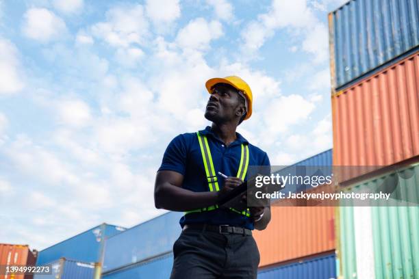 the engineer working with cargo containers - dock worker stock pictures, royalty-free photos & images