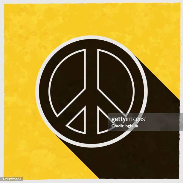 peace. icon with long shadow on textured yellow background - hippie protest stock illustrations