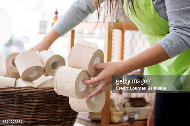 ecological toilet paper rolls, recycled paper in a zero waste store - buying toilet paper stock pictures, royalty-free photos & images