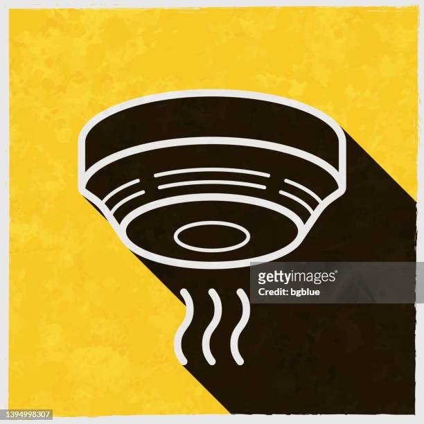 smoke detector. icon with long shadow on textured yellow background - evacuation stock illustrations