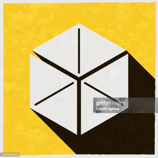 isometric cube. icon with long shadow on textured yellow background - black cube stock illustrations