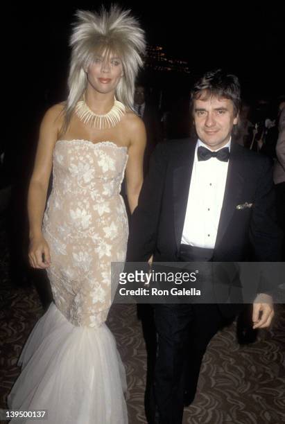Actor Dudley Moore and date Brogan Lane attend the First Annual American Cinematheque Award Salute to Eddie Murphy on February 28, 1986 at Century...