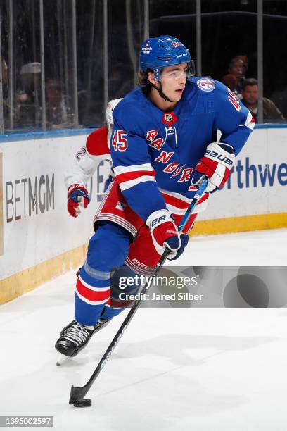 Braden Schneider of the New York Rangers skates with the puck against the Montreal Canadiens at Madison Square Garden on April 27, 2022 in New York...