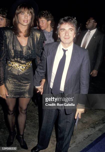 Actor Dudley Moore and date Brogan Lane attend the "Like Father, Like Son" Hollywood Premiere on September 17, 1987 at Mann's Chinese Theatre in...