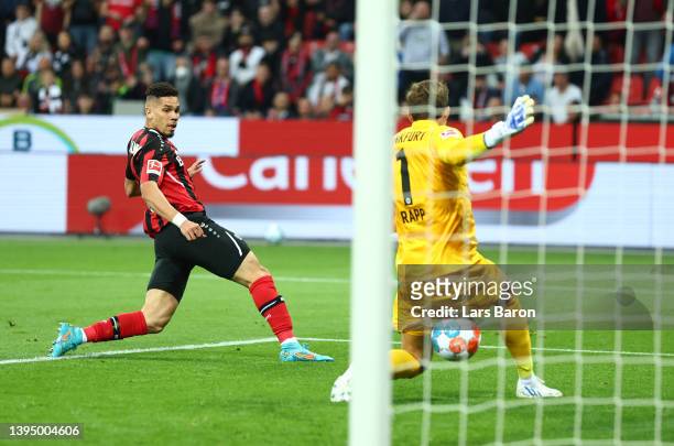 Paulinho of Bayer Leverkusen scores their side's first goal during the Bundesliga match between Bayer 04 Leverkusen and Eintracht Frankfurt at...