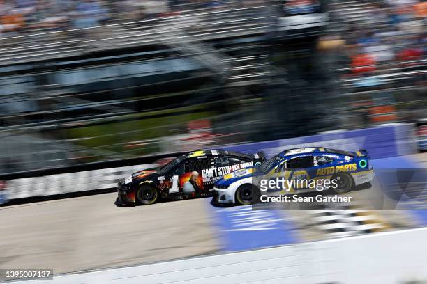 Ross Chastain, driver of the Pitbull Tour 2022 Chevrolet, and Chase Elliott, driver of the NAPA Auto Parts Chevrolet, race during the NASCAR Cup...