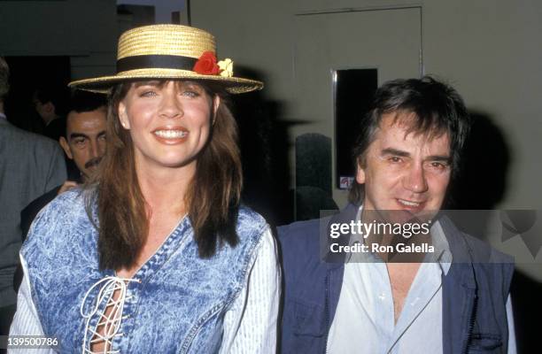 Actor Dudley Moore and wife Brogan Lane attend the "Arthur 2: On the Rocks" Westwood Premiere on June 22, 1988 at Mann Bruin Theatre in Westwood,...