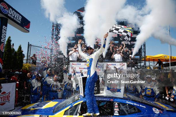Chase Elliott, driver of the NAPA Auto Parts Chevrolet, celebrates in victory lane after winning the NASCAR Cup Series DuraMAX Drydene 400 presented...
