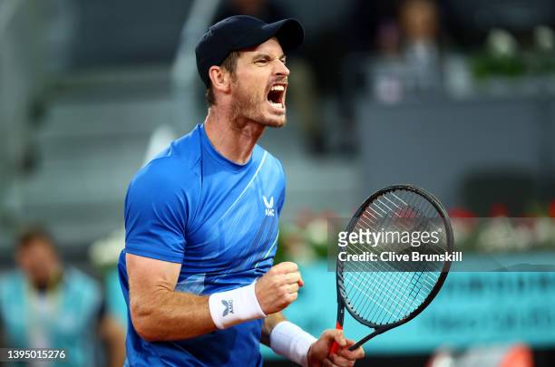 Andy Murray of Great Britain celebrates after winning match point during their First Round match against Dominic Thiem of Austria on day five of the...