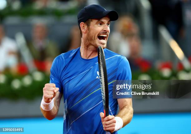 Andy Murray of Great Britain celebrates after winning match point during their First Round match against Dominic Thiem of Austria on day five of the...