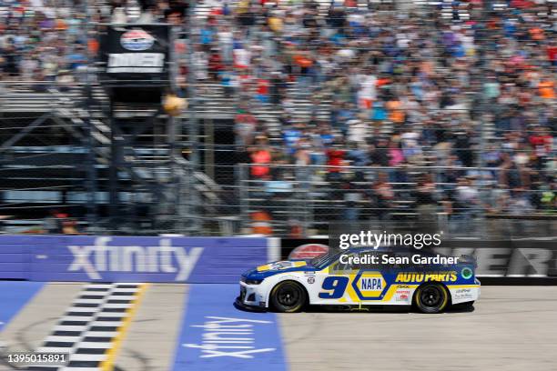 Chase Elliott, driver of the NAPA Auto Parts Chevrolet, crosses the finish line to win the NASCAR Cup Series DuraMAX Drydene 400 presented by...