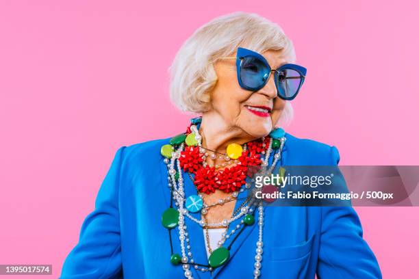 cool and stylish senior old woman with fashionable clothes - beautiful granny 個照片及圖片檔