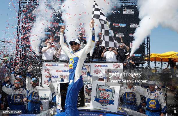 Chase Elliott, driver of the NAPA Auto Parts Chevrolet, celebrates in victory lane after winning the NASCAR Cup Series DuraMAX Drydene 400 presented...