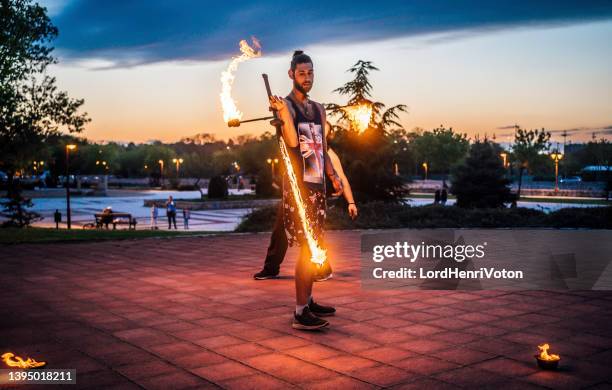 playing with fire - juggling stock pictures, royalty-free photos & images