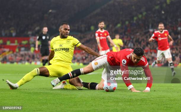 Rico Henry of Brentford brings down Cristiano Ronaldo of Manchester United inside the box, which results in a penalty, during the Premier League...