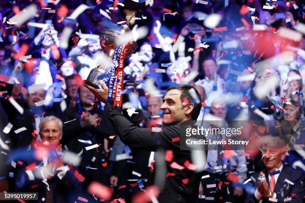 Ronnie O'Sullivan of England celebrates with the Betfred World Snooker Championship trophy after winning the Betfred World Snooker Championship Final...