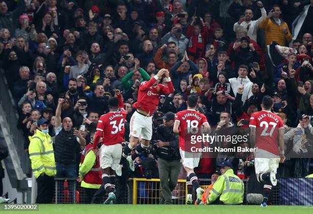 Cristiano Ronaldo of Manchester United celebrates scoring their side's second goal from a penalty with teammates during the Premier League match...