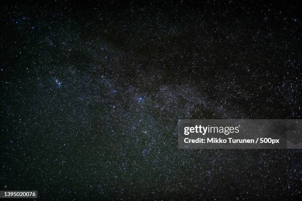 low angle view of stars in sky at night,suomussalmi,finland - stars sky stockfoto's en -beelden