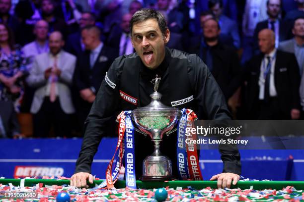 Ronnie O'Sullivan of England poses with the Betfred World Snooker Championship trophy after winning the Betfred World Snooker Championship Final...