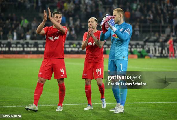 Willi Orban, Kevin Kampl and Peter Gulacsi of RB Leipzig applauds their fans after the final whistle of the Bundesliga match between Borussia...