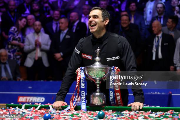 Ronnie O'Sullivan of England poses with the Betfred World Snooker Championship trophy after winning the Betfred World Snooker Championship Final...