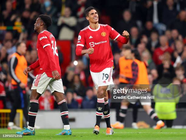 Raphael Varane of Manchester United celebrates scoring their side's third goal during the Premier League match between Manchester United and...