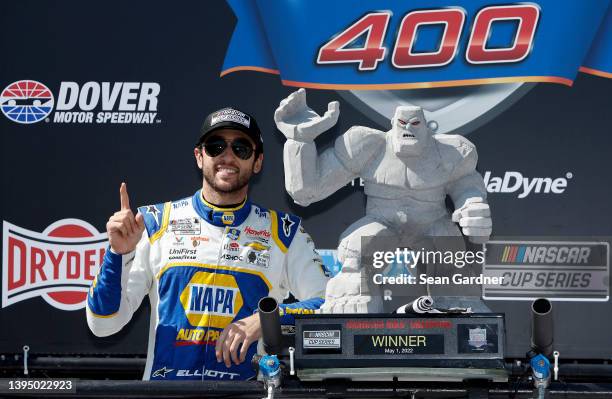 Chase Elliott, driver of the NAPA Auto Parts Chevrolet, celebrates in victory lane after winning the NASCAR Cup Series DuraMAX Drydene 400 presented...