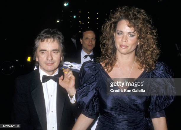 Actor Dudley Moore and wife Brogan Lane attend the 60th Annual Academy Awards After Party on April 11, 1988 at Spago in West Hollywood, California.
