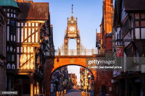 sunrise glow, eastgate clock, chester, cheshire, england - chester england stock pictures, royalty-free photos & images