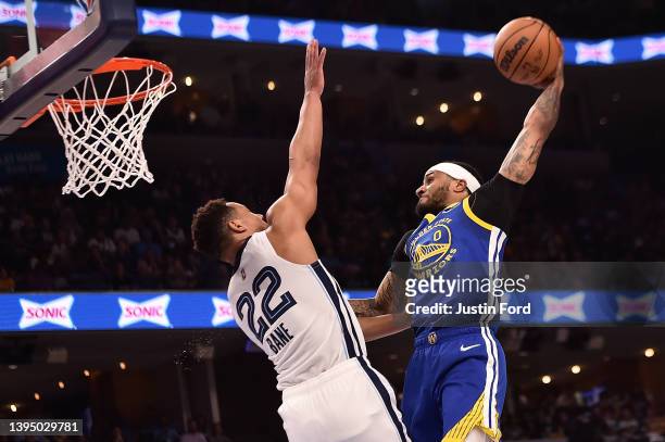 Gary Payton II of the Golden State Warriors dunks against Desmond Bane of the Memphis Grizzlies during Game One of the Western Conference Semifinals...