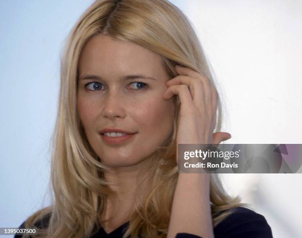 German model and actress Claudia Schiffer, poses at a photocall for L'oreal products, on the rooftop of the Palais des Festivals during the Cannes...