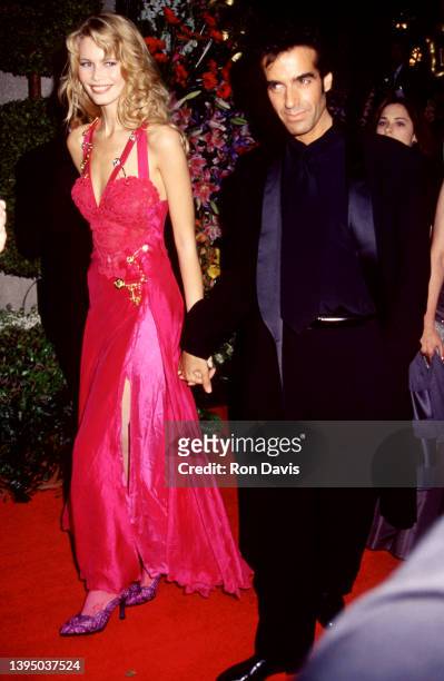 German model and actress Claudia Schiffer and partner, American magician David Copperfield, attend the 66th Annual Academy Awards on March 21, 1994...