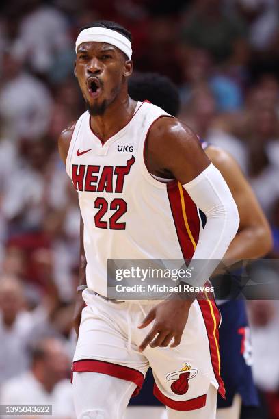 Jimmy Butler of the Miami Heat celebrates a three pointer against the Philadelphia 76ers during the first quarter in Game One of the Eastern...