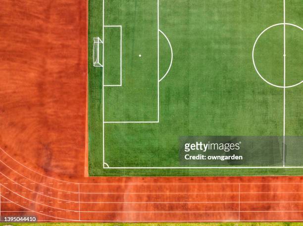 aerial photo of the soccer field and running track. - football pitch aerial stock pictures, royalty-free photos & images
