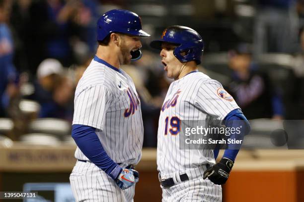 Mark Canha reacts with Pete Alonso of the New York Mets after hitting a solo home run during the third inning against the Atlanta Braves at Citi...