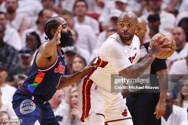 Tucker of the Miami Heat is defended by James Harden of the Philadelphia 76ers during the first half in Game One of the Eastern Conference Semifinals...