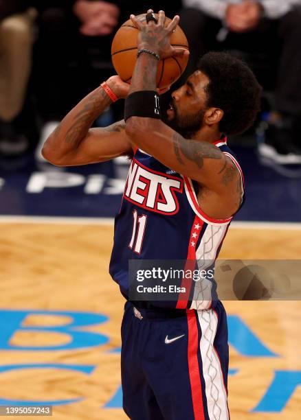 Kyrie Irving of the Brooklyn Nets takes a shot during Game Four of the Eastern Conference First Round Playoffs against the Boston Celtics at Barclays...