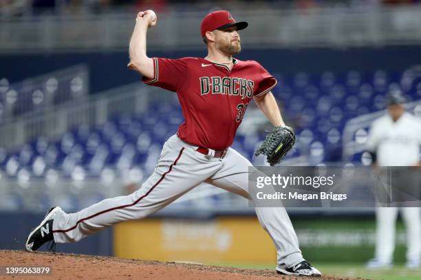 Ian Kennedy of the Arizona Diamondbacks delivers a pitch against the Miami Marlins during the ninth inning at loanDepot park on May 02, 2022 in...